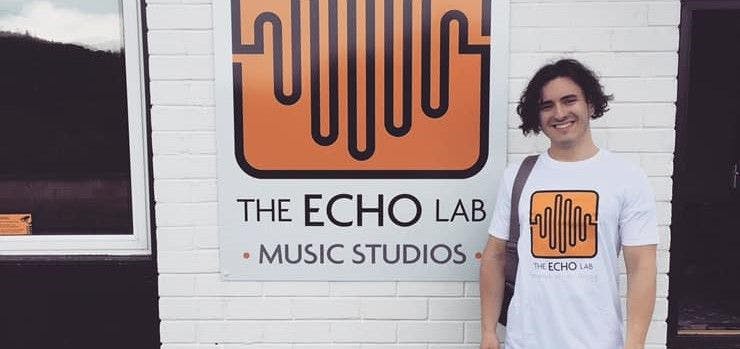 Rapper Elliot Stradling stands outside The Echo Lab music studios 